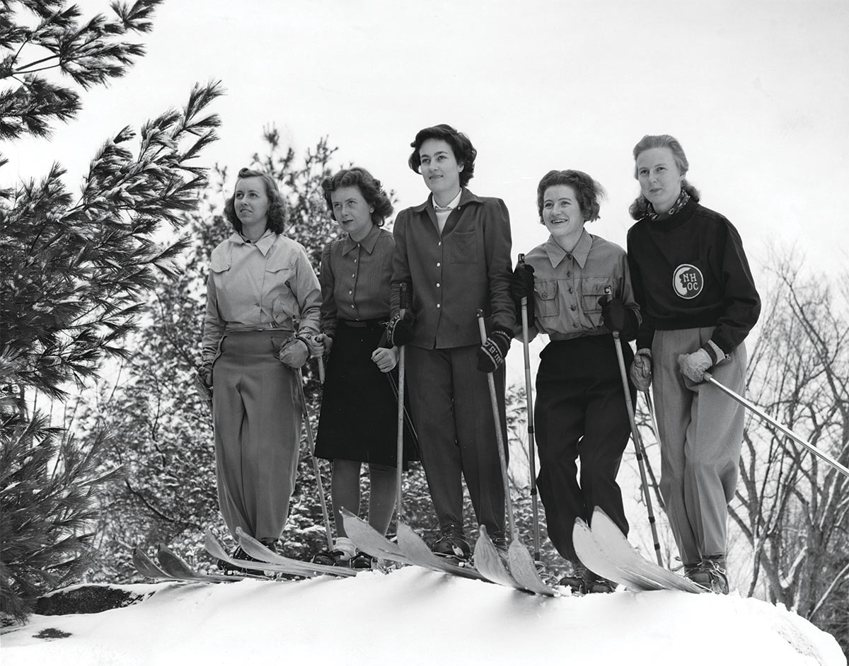 The UNH women’s ski team, circa 1941 standing side-by-side at the top of a hill