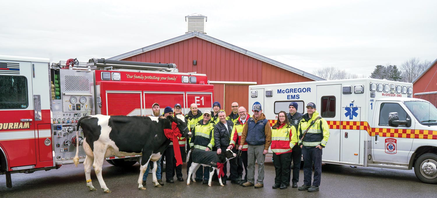 first responders with two cows