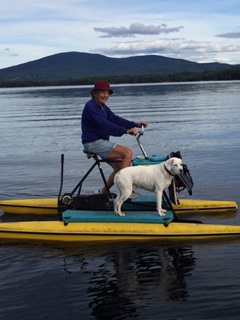 Joan Lamson on a lake with her dog