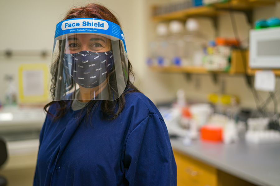 UNH researcher in the lab