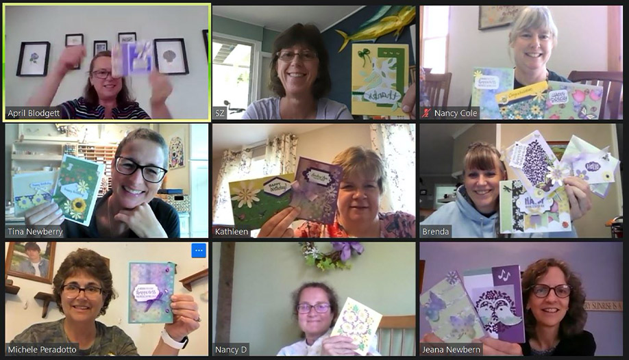 The “mooses” holding up their crafts during a Zoom call