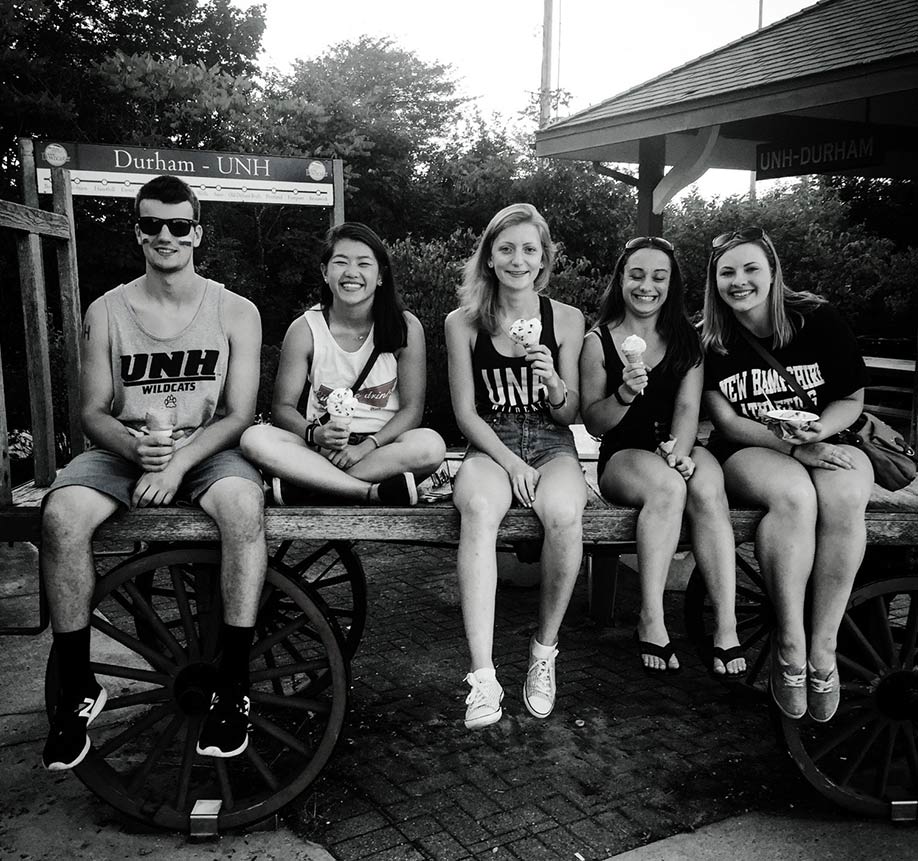 Elizabeth Tveter sitting on a wagon with friends on 2018's homecoming