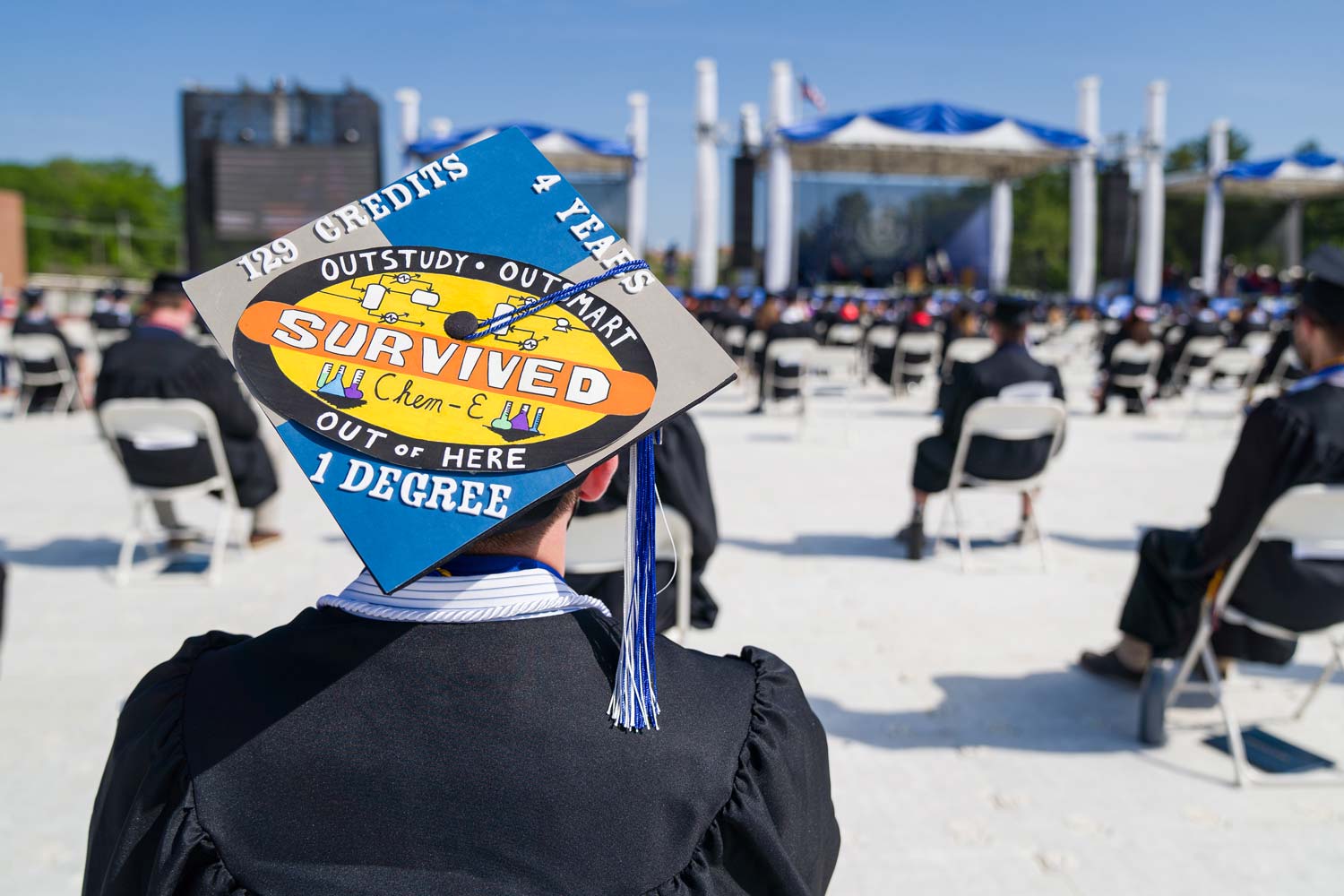 A funny graduation cap that reads "129 credits, 4 years, 1 diploma" surrounding a badge-type drawing stating that they survived their Chemical Engineering degree