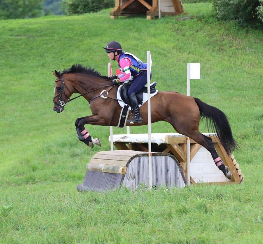 Julie Walden Howard competing with her former Thoroughbred racehorse named Sweetie in the sport of eventing.