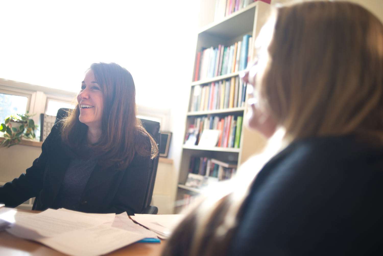 Sharyn Potter at table with colleague