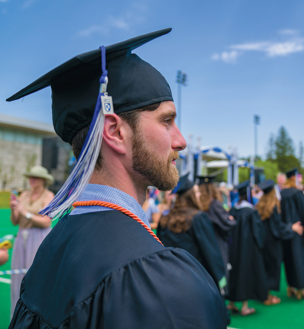 Side profile of graduate looking off into distance