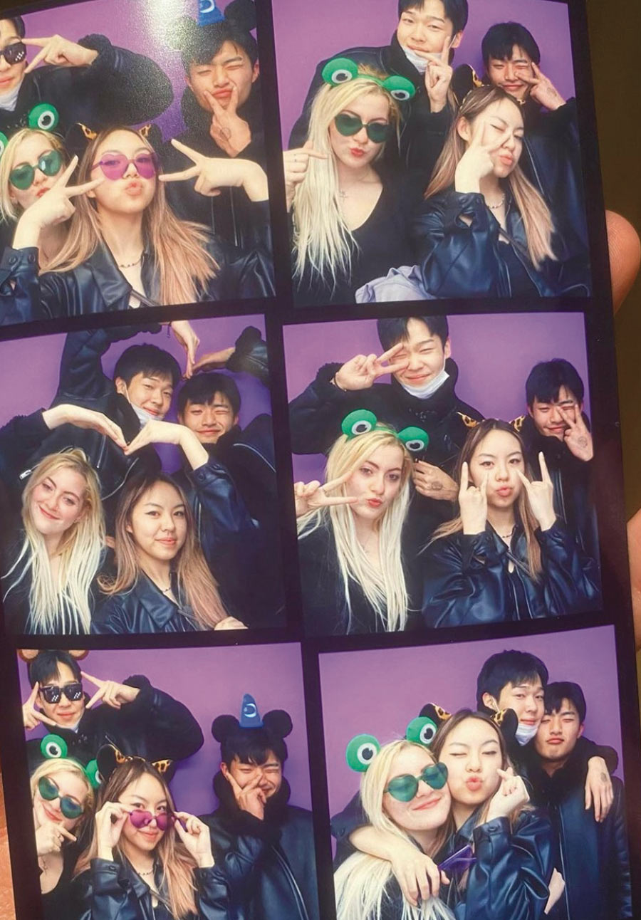 group of students posing together in a photo booth