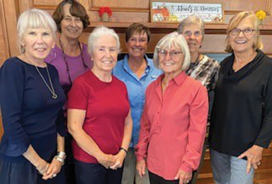 A landscape photograph of AXO sisters Linda King ’68, Jill Feldman Brandt ’68, Suzanne Blanchard Shore ’67, Irene Goodman Carrier ’68, Missy Brigida Windsor ’68 ’76G, Jan Maddocks Sheen ’68 and Joyce Wehren Hatch ’68 meeting in Portsmouth back in October smiling and posing for a picture together smiling
