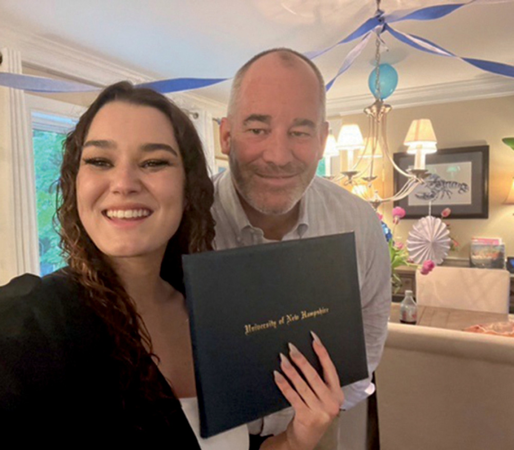 Tyler O’Connell ’23 and her dad, Sean O’Connell ’87 ’95JD, at a commencement party