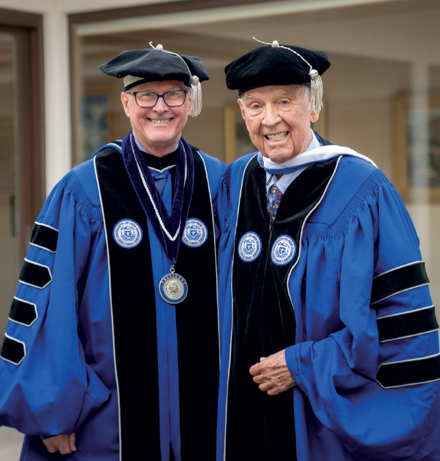 Dana Hamel and President James W. Dean Jr. in cap and gowns