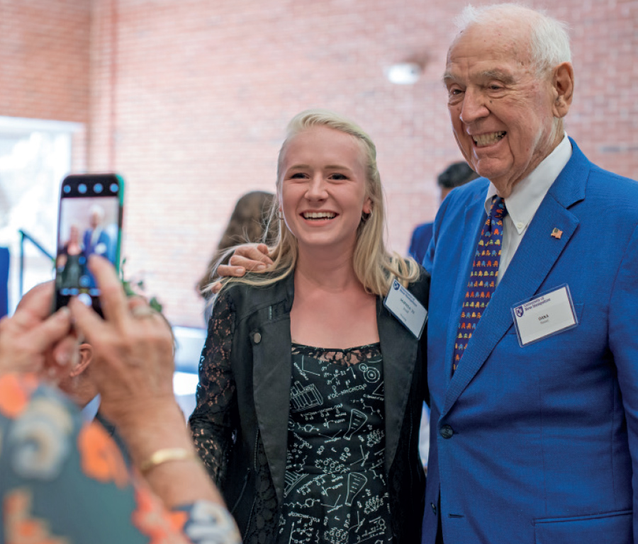 Hamal taking photo with female student