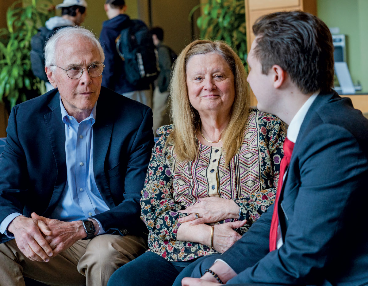 Ted Ristaino ’75G and his wife, Christine, chatting with Jason Plant ’23