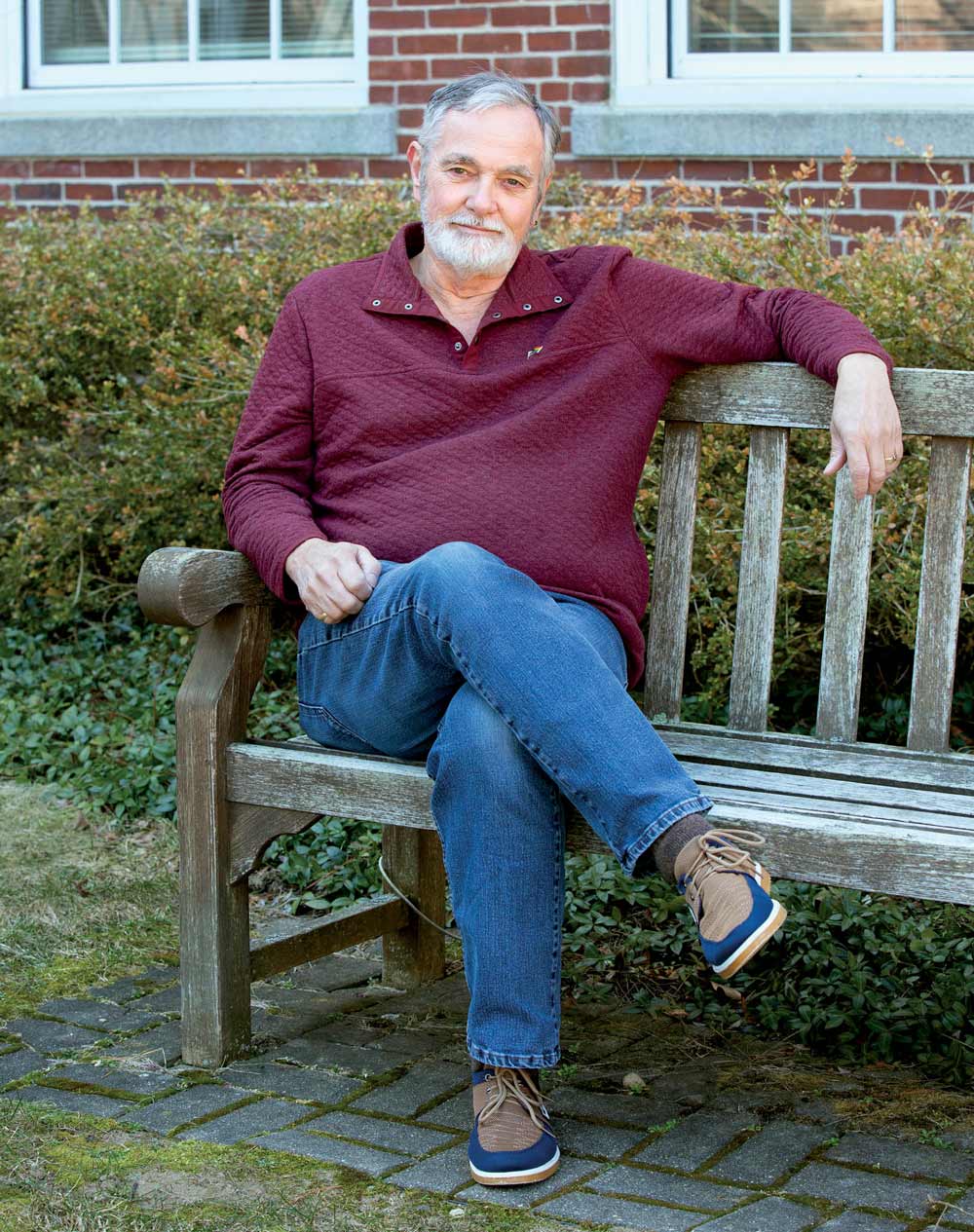 Paul Tosi sitting on a wooden bench