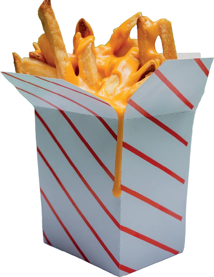side of french fries in a white box with red stripes