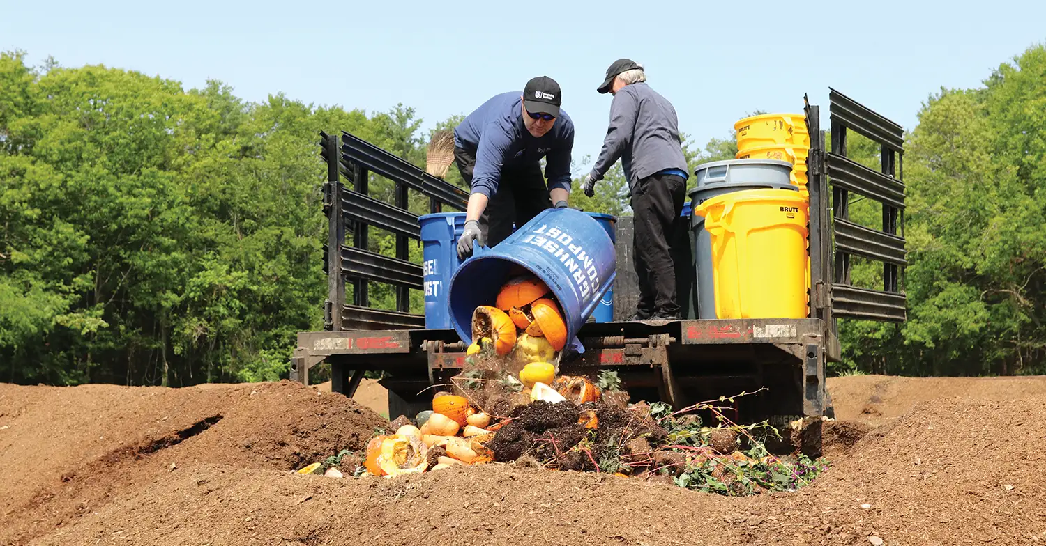 Kevin Janelle and Richard Turcotte delivering food waste to a farm