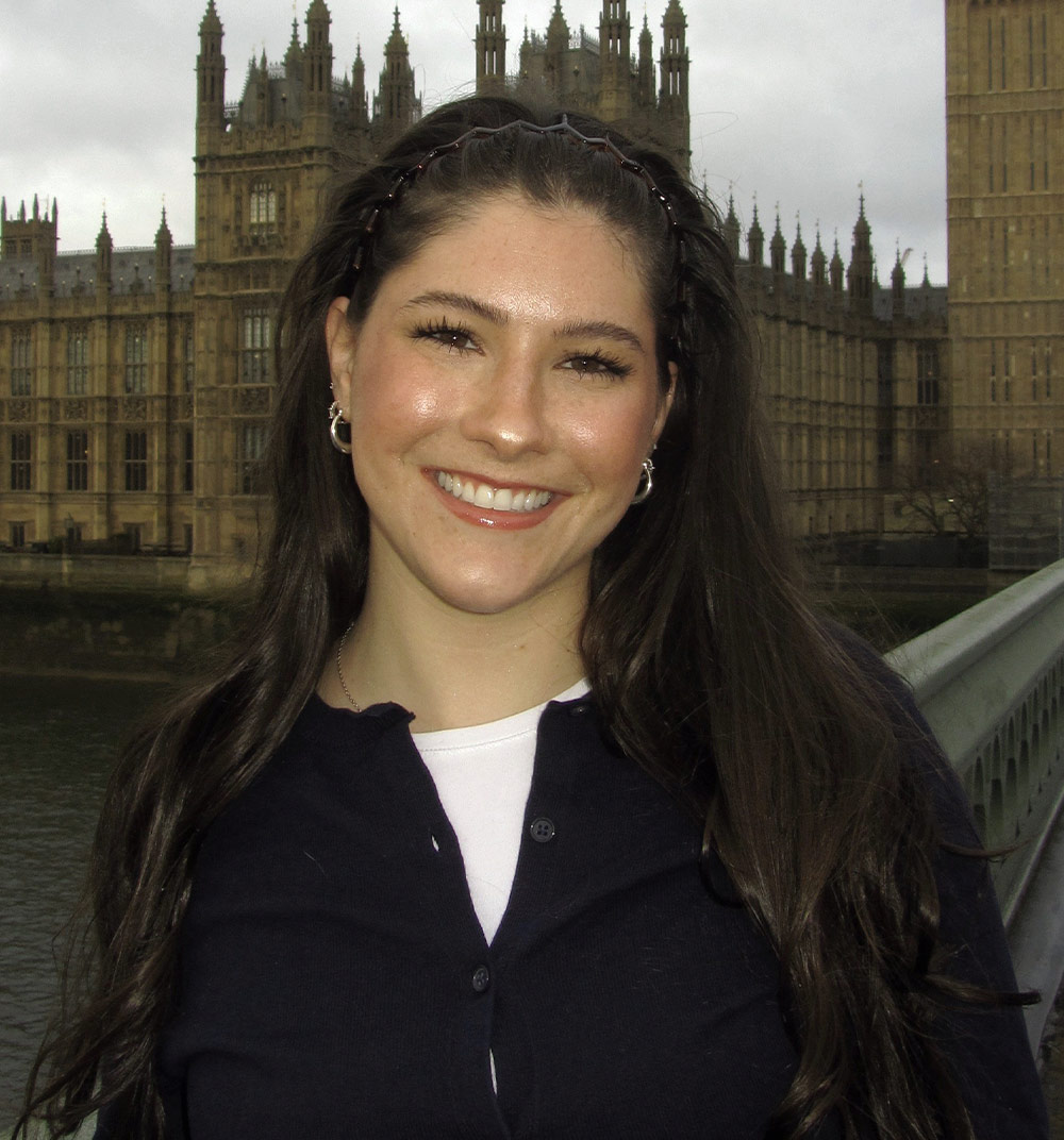 headshot of Grace Simmons standing in front of Big Ben