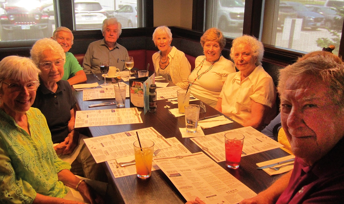 UNH Class of 1961 lunch July 2025 in Concord: (pictured left to right) Pat D’Allesandro, Pat Coolidge, Art Monty, Bill Tighe, Pam Monty, Lois Magenau, Judy Holbrook, Lou D’Allesandro; Here everyone is pictured smiling seated at a restaurant table with menus and drinks