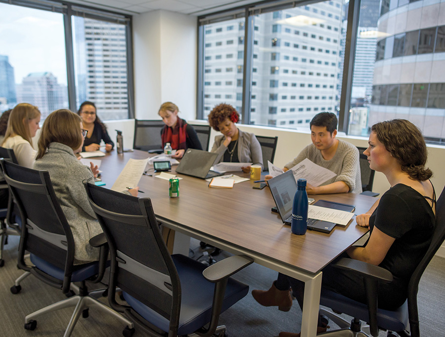 internship students sitting at conference table