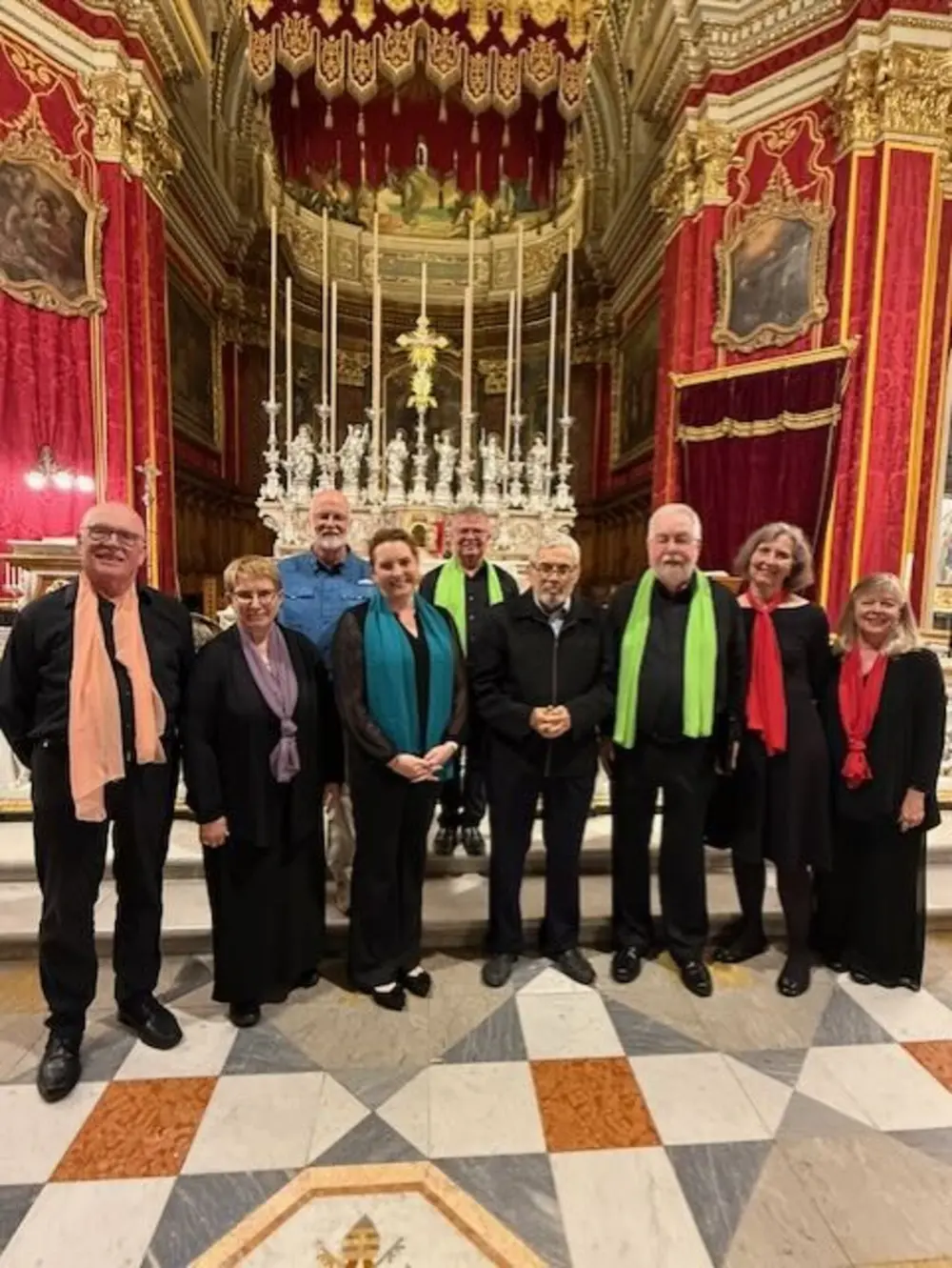 Members of the New Hampshire Friendship Chorus pose inside an ornate hall in Malta.